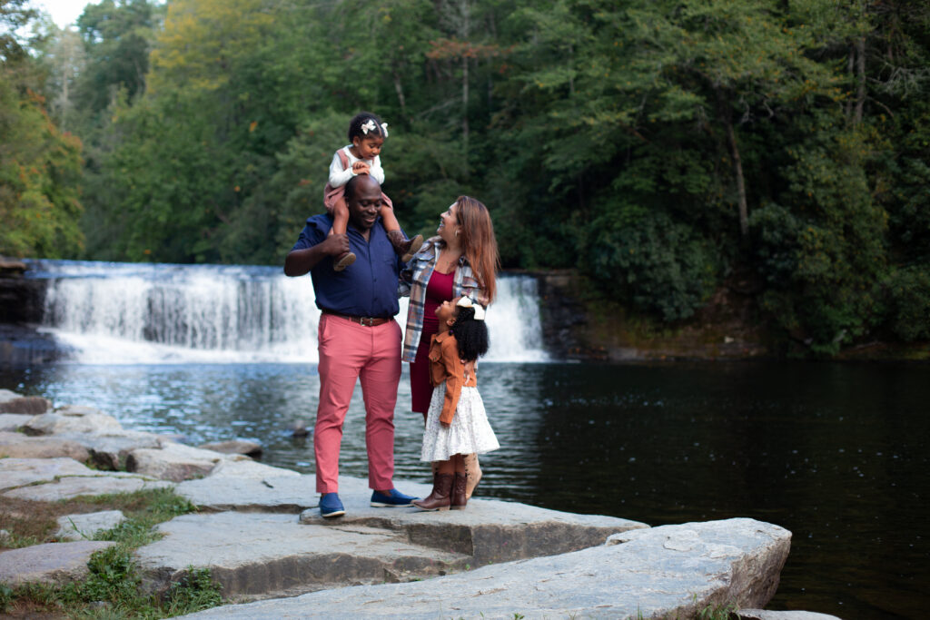 lifestyle portrait family of four in front of a water fall